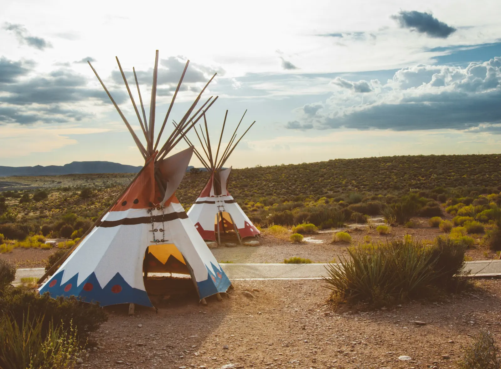 Two tipis at golden hour in the high desert